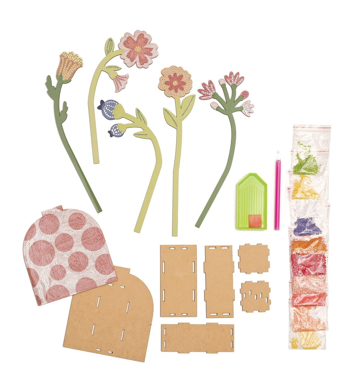 Le coffret inclut un vase en bois, fleurs à strasser, strass rouges, stylet, cire et plateau.