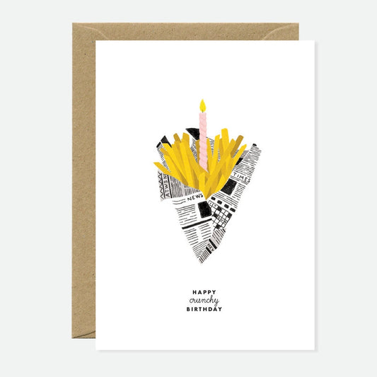 Carte d’anniversaire Happy Crunchy Birthday illustrée d’un cornet de frites dorées avec une bougie rose