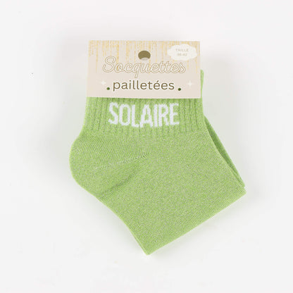 detail message solaire socquettes paillettes femme