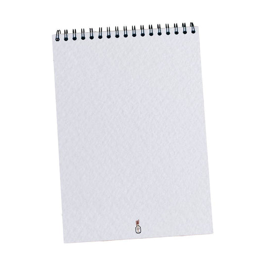 Carnet de dessin ouvert, montrant les pages vierges texturées parfaites pour aquarelle et croquis.